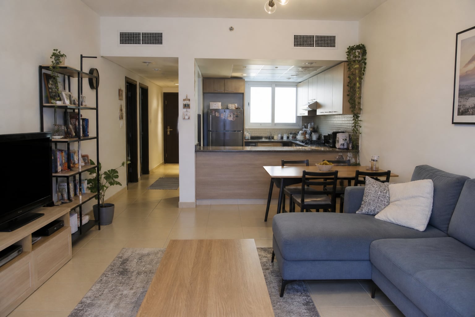 Open-plan apartment renovation idea with practical mid-range finishes